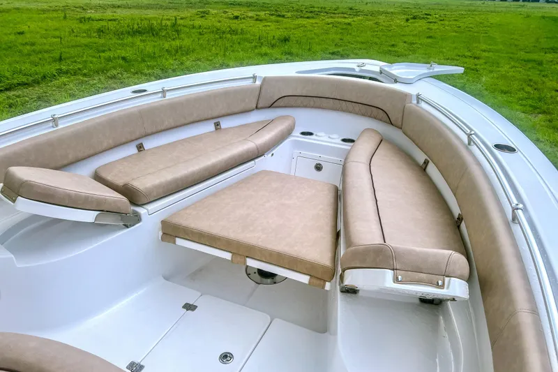 Slide: The Image of 2019 Sportsman Open 282 Center Console boat with tan cushioned seating. - 6