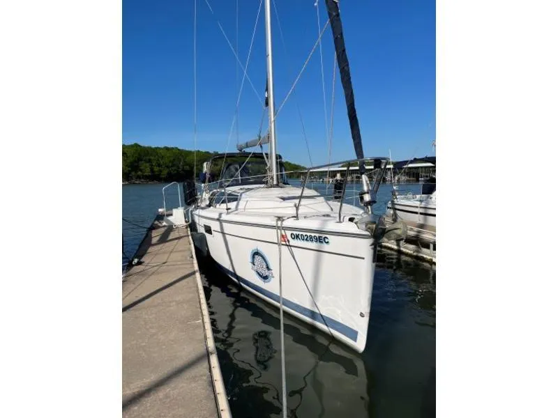 The Image of 2012 Hunter 36E sailboat docked at a marina on a sunny day. - 1