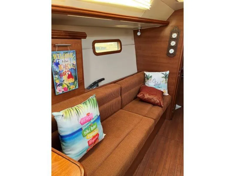 Slide: The Image of Interior of 2012 Hunter 36E sailboat with colorful pillows and wall art. - 10