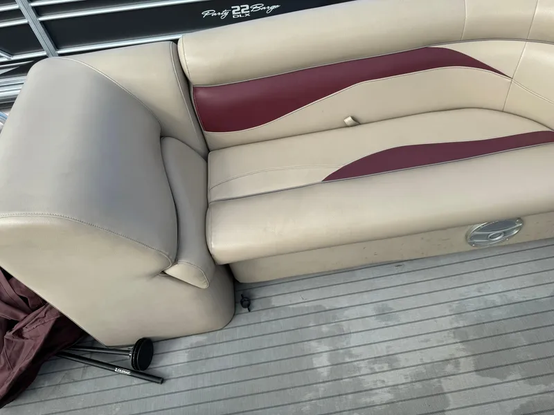 Slide: The Image of Beige and maroon seating on 2016 Godfrey Sweet Water boat deck. - 10