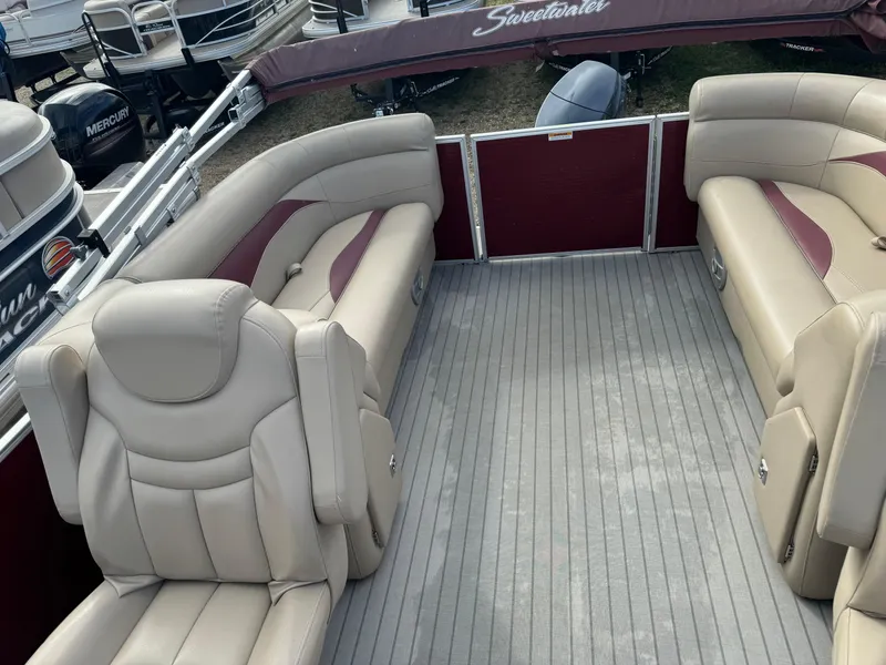 Slide: The Image of 2016 Godfrey Sweet Water pontoon boat interior with beige seating and maroon accents. - 14