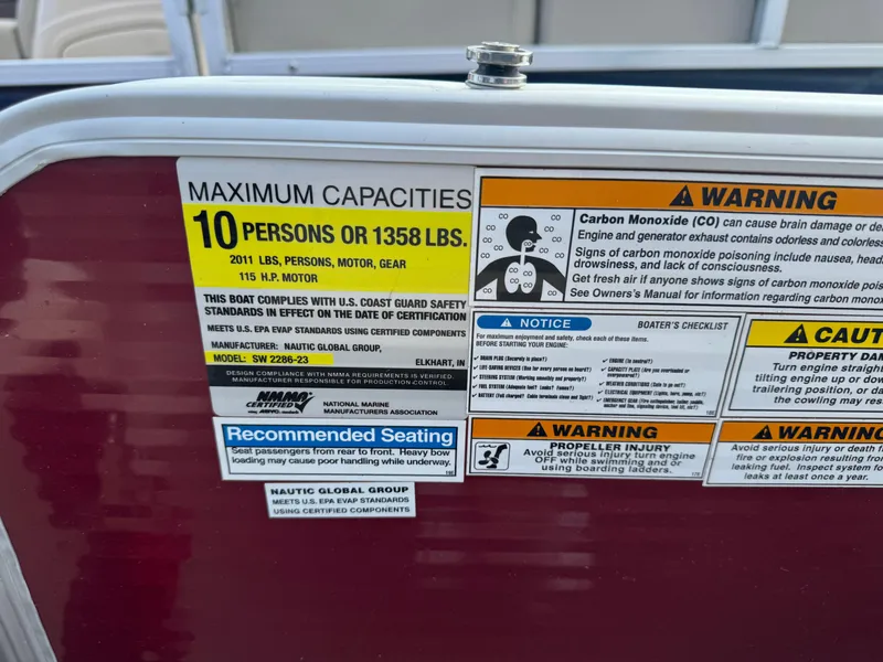 Slide: The Image of Capacity and safety warnings on 2016 Godfrey Sweet Water boat, maximum 10 persons or 1358 lbs. - 16