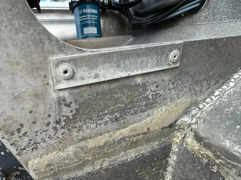 Slide: The Image of Close-up of a 2016 Godfrey Sweet Water boat hull identification number plate. - 3