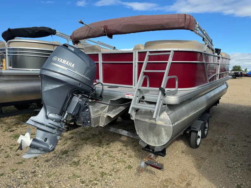 Slide: The Image of 2016 Godfrey Sweet Water pontoon boat with Yamaha motor, parked on a trailer. - 5