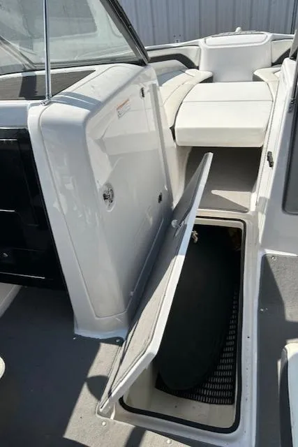 Slide: The Image of 2016 Yamaha Boats AR240 interior with open storage compartment. - 12