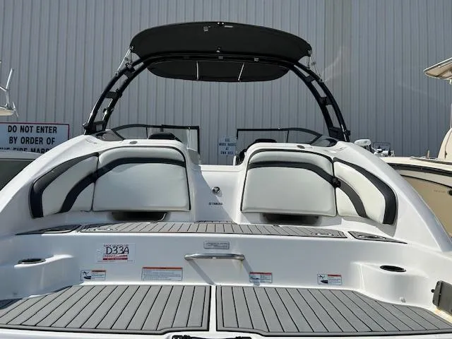 Slide: The Image of 2016 Yamaha Boats AR240 rear view with swim platform and seating. - 2