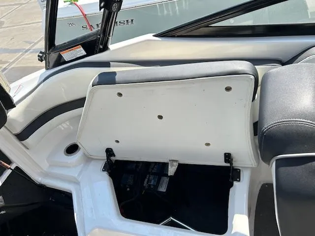 Slide: The Image of 2016 Yamaha Boats AR240 interior storage compartment with open seat. - 5