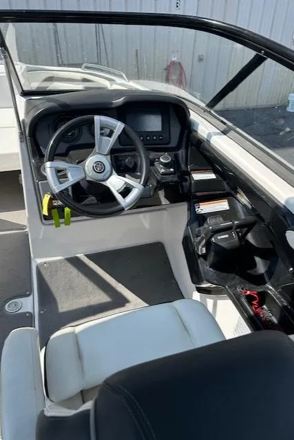 Slide: The Image of 2016 Yamaha Boats AR240 cockpit with steering wheel and control panel. - 9