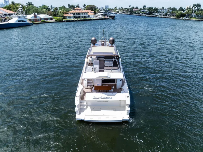 Slide: The Image of 2015 Ferretti Yachts 690 cruising on a scenic waterway. - 10