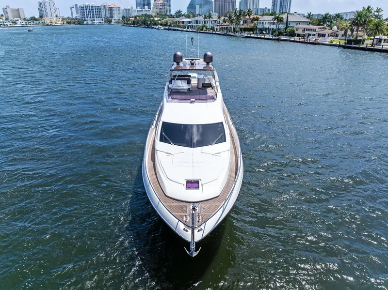 Slide: The Image of Ferretti Yachts 690, 2015 model, cruising on a sunny waterfront with city skyline. - 14