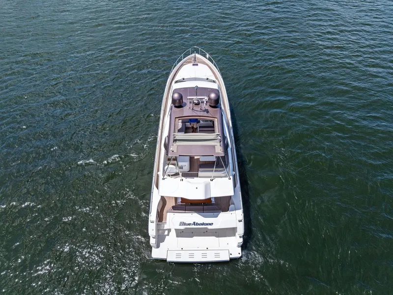 Slide: The Image of Aerial view of 2015 Ferretti Yachts 690 cruising on open water. - 17