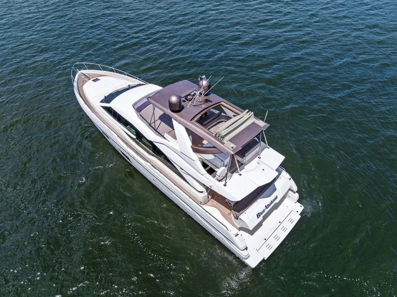 Slide: The Image of 2015 Ferretti Yachts 690 cruising on open water, aerial view. - 18
