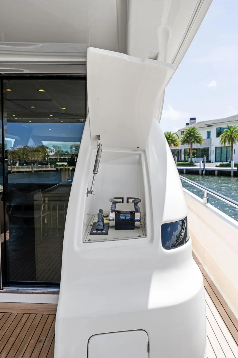 Slide: The Image of 2015 Ferretti Yachts 690 control panel on deck, with waterfront view. - 22