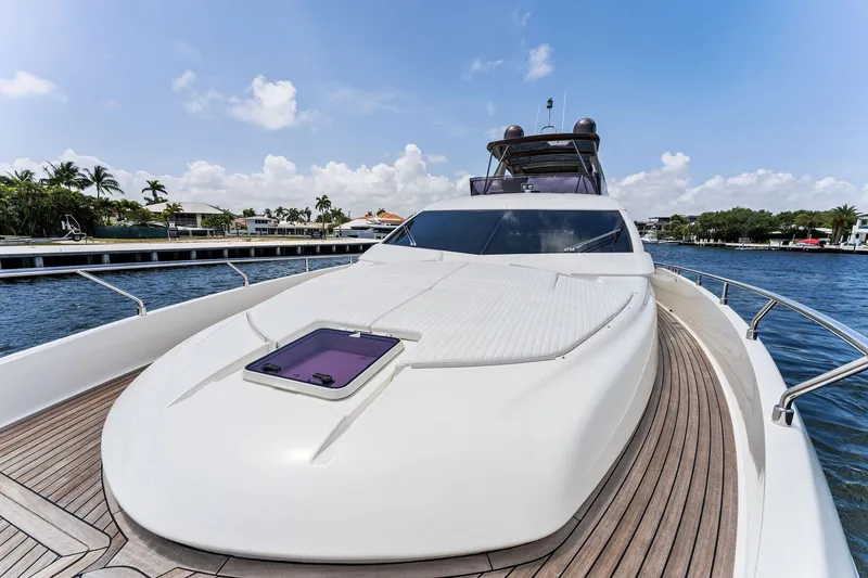 Slide: The Image of 2015 Ferretti Yachts 690 on water, showcasing sleek design and luxurious deck. - 25