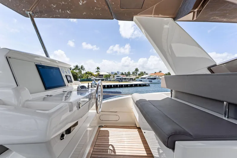 Slide: The Image of Luxurious 2015 Ferretti Yachts 690 helm with modern controls and waterfront view. - 32