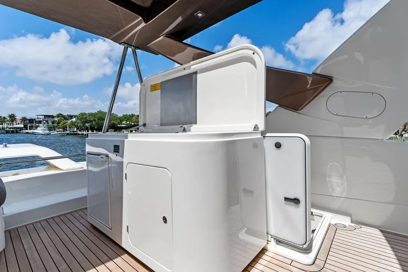 Slide: The Image of Luxury outdoor kitchen on 2015 Ferretti Yachts 690, featuring sleek design and waterfront view. - 35