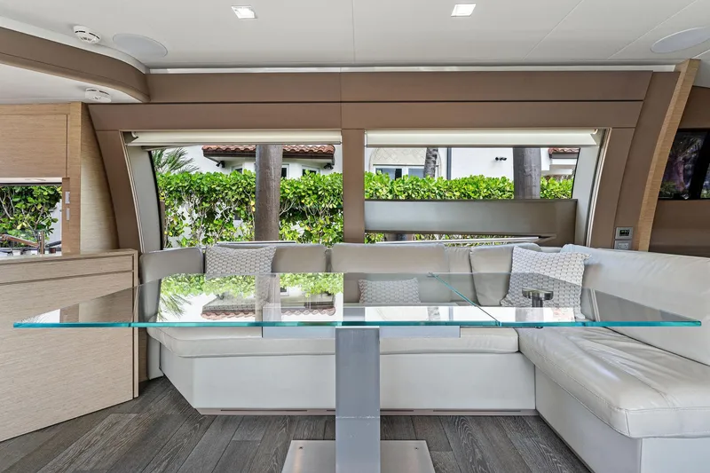 Slide: The Image of Luxurious interior of 2015 Ferretti Yachts 690 with modern glass table and white seating. - 48