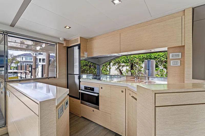 Slide: The Image of Modern kitchen interior of 2015 Ferretti Yachts 690, featuring sleek cabinetry and appliances. - 49
