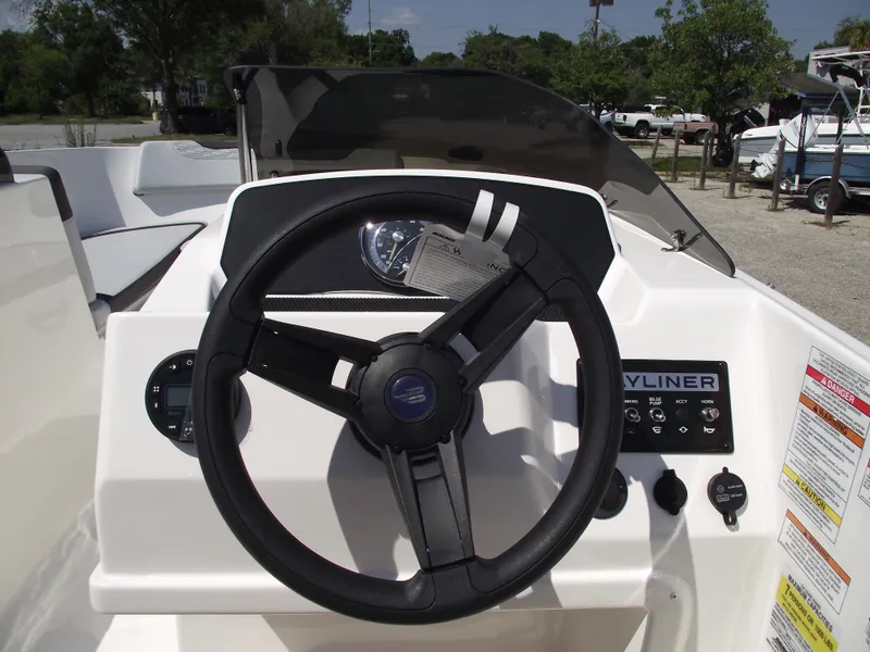 Slide: The Image of 2024 Bayliner Element M17 boat steering console with controls and dashboard. - 14