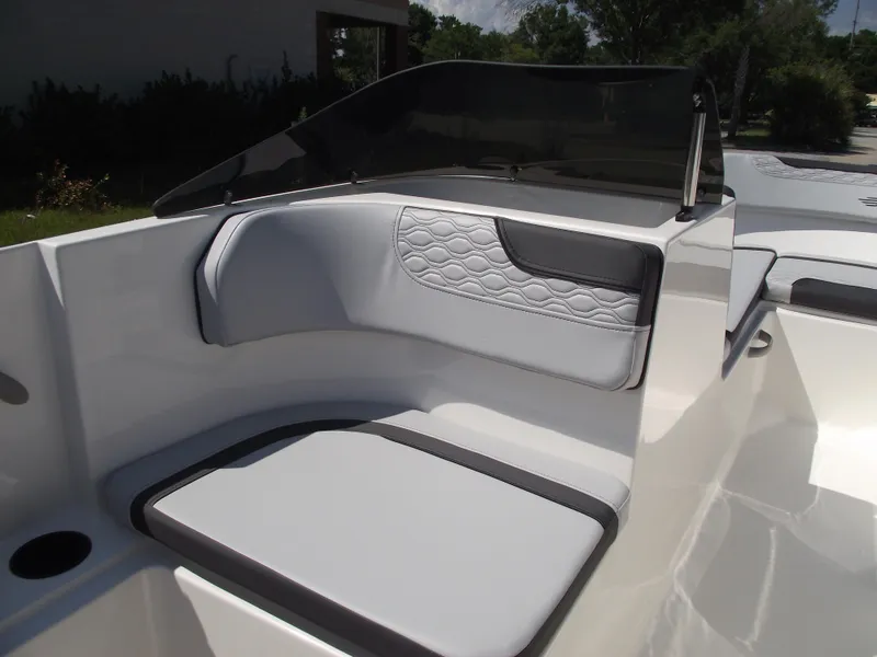 Slide: The Image of 2024 Bayliner Element M17 boat interior seating with quilted upholstery. - 17