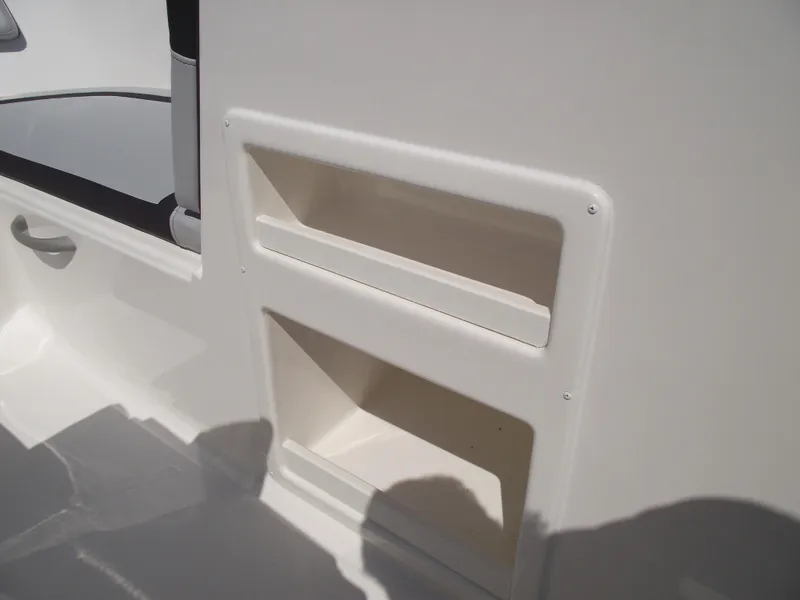 Slide: The Image of 2024 Bayliner Element M17 interior storage compartments. - 19