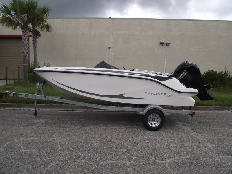Slide: The Image of 2024 Bayliner Element M17 boat on a trailer, side view. - 2