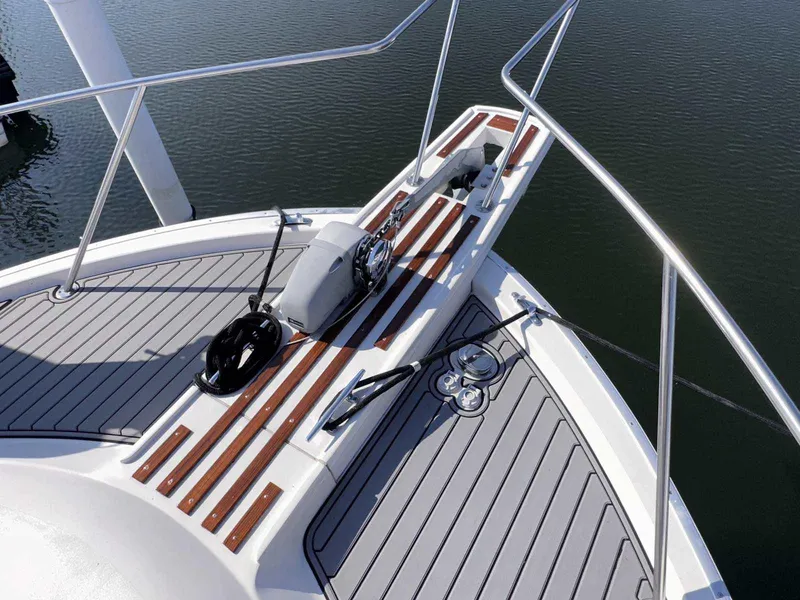 Slide: The Image of 1987 Silverton 40 Double Cabin boat deck with wood accents and railing. - 10