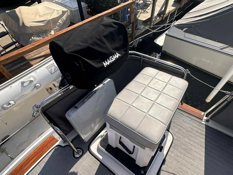 Slide: The Image of 1987 Silverton 40 Double Cabin boat deck with seating and covered grill. - 14