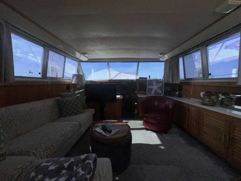 Slide: The Image of Interior of 1987 Silverton 40 Double Cabin with seating and panoramic windows. - 46