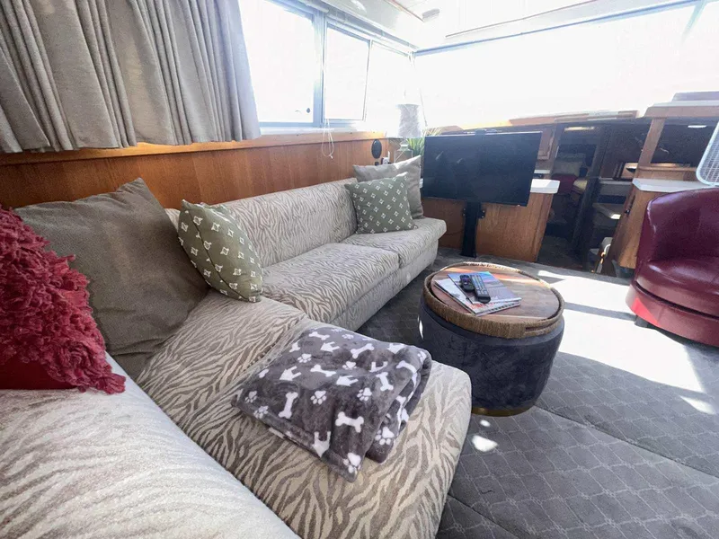 Slide: The Image of Cozy interior of 1987 Silverton 40 Double Cabin with plush seating and modern decor. - 47