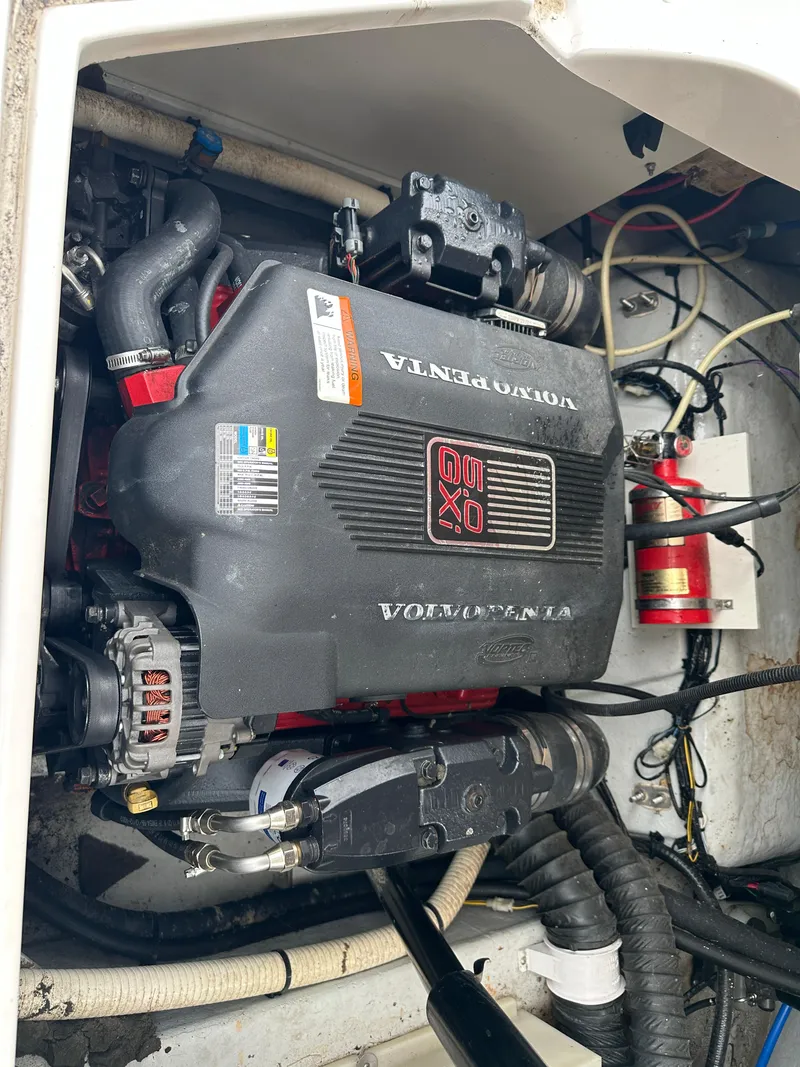Slide: The Image of 2003 Four Winns 205 Sundowner engine compartment with Volvo Penta motor. - 17