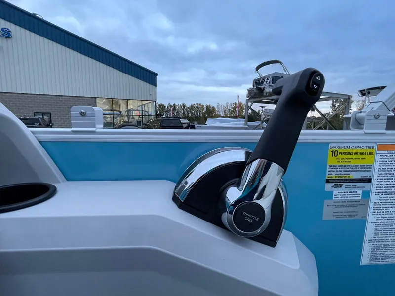 Slide: The Image of Close-up of the control lever on a 2024 Godfrey Sweetwater 2086 BF boat. - 12