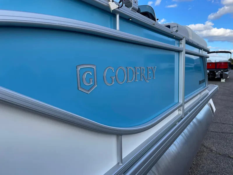 Slide: The Image of 2024 Godfrey Sweetwater 2086 BF pontoon boat, blue and white exterior. - 19