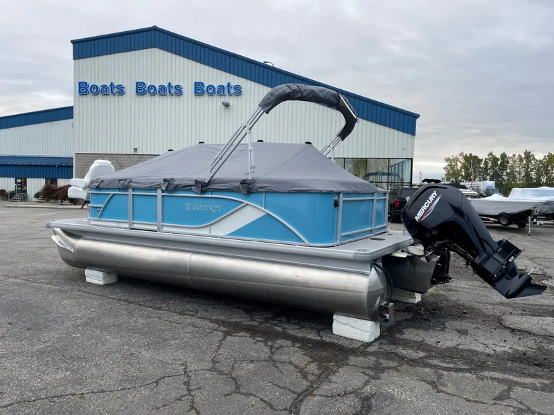 Slide: The Image of 2024 Godfrey Sweetwater 2086 BF pontoon boat with cover and Mercury outboard motor. - 2