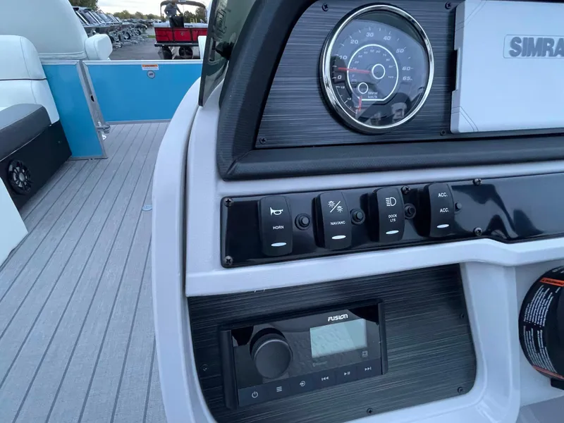 Slide: The Image of Control panel of 2024 Godfrey Sweetwater 2086 BF pontoon boat with gauges and switches. - 9