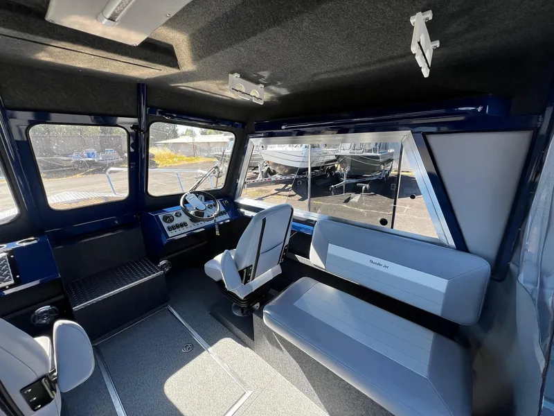 Slide: The Image of Interior of 2024 Thunder Jet 22 Alexis Pro boat with seating and steering console. - 10