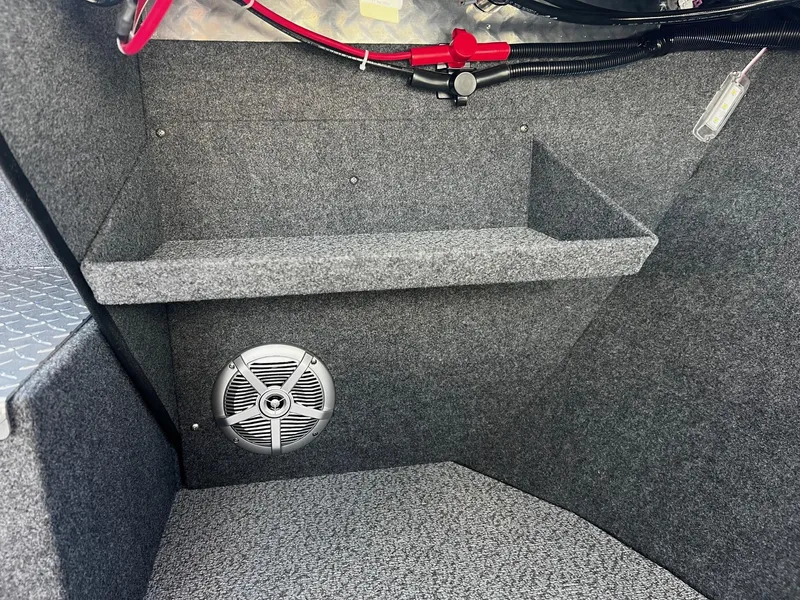 Slide: The Image of Interior of 2024 Thunder Jet 22 Alexis Pro boat with speaker and storage shelf. - 14