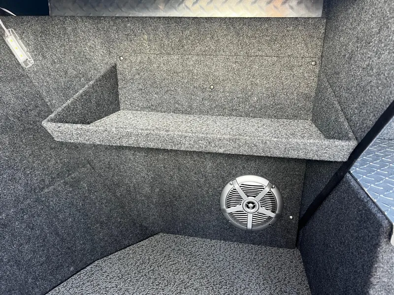 Slide: The Image of Interior of 2024 Thunder Jet 22 Alexis Pro boat with speaker and storage shelf. - 15