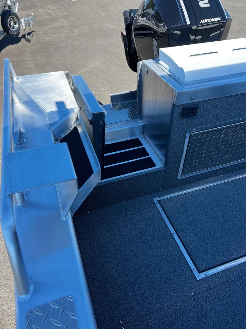 Slide: The Image of 2024 Thunder Jet 22 Alexis Pro boat interior with storage compartments and seating. - 20