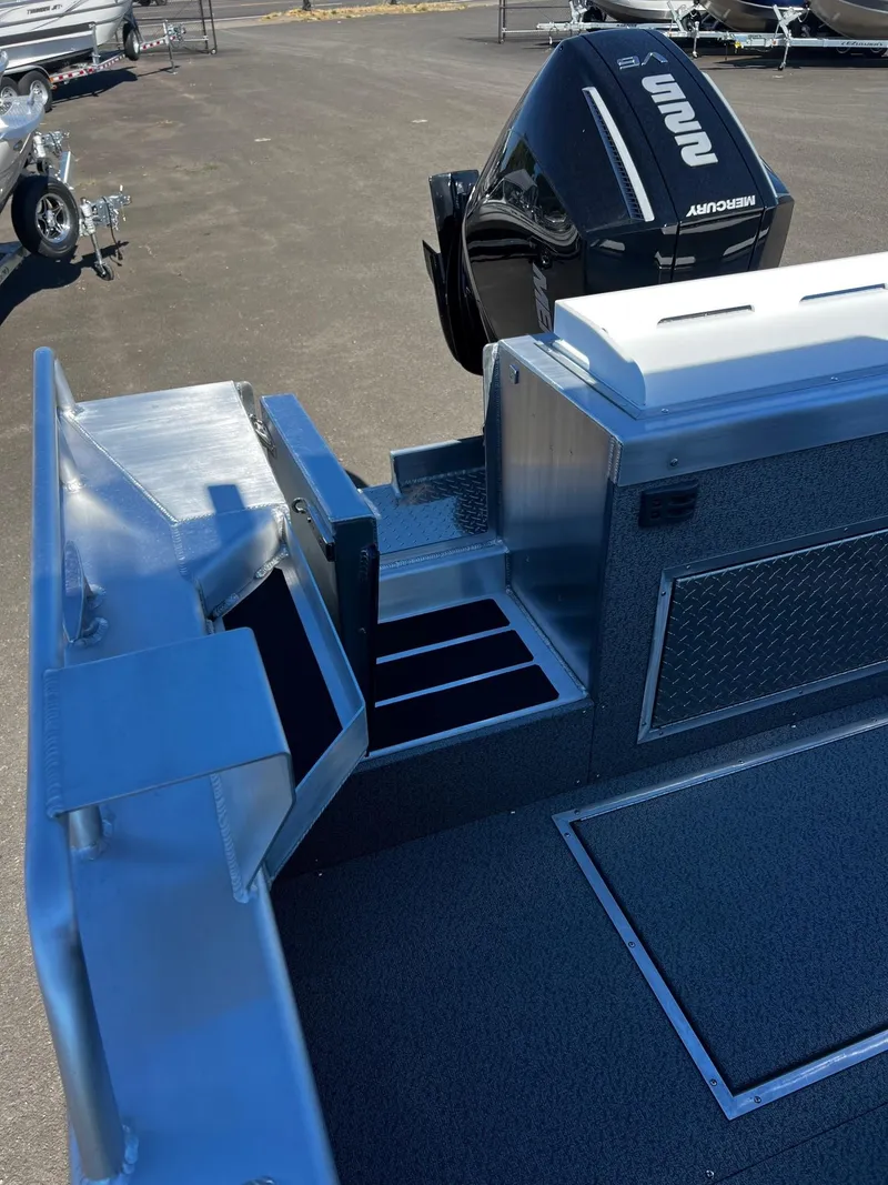 Slide: The Image of 2024 Thunder Jet 22 Alexis Pro boat with outboard motor and storage compartments. - 21