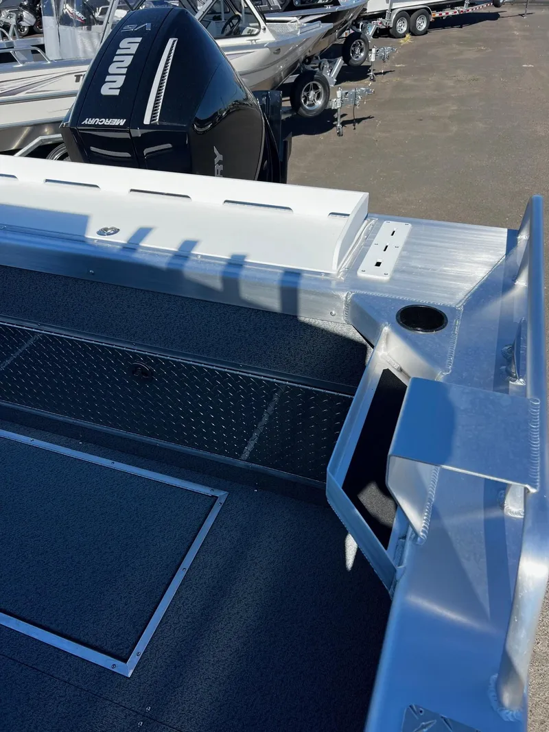 Slide: The Image of 2024 Thunder Jet 22 Alexis Pro boat interior with motor in background. - 22