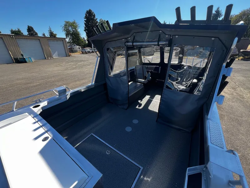 Slide: The Image of 2024 Thunder Jet 22 Alexis Pro boat interior with covered cockpit and seating. - 29
