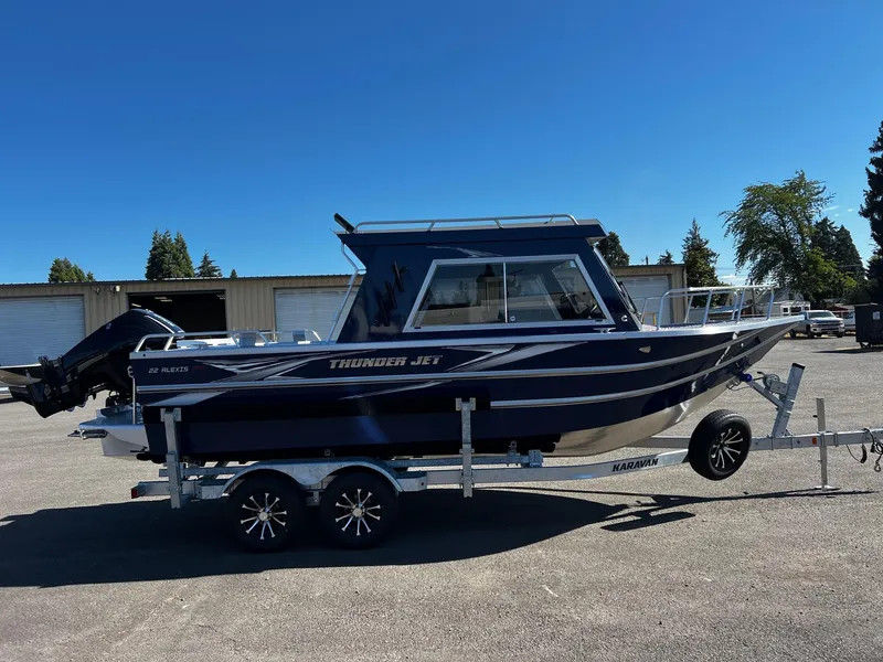 Slide: The Image of 2024 Thunder Jet 22 Alexis Pro boat on a trailer in a parking lot. - 6