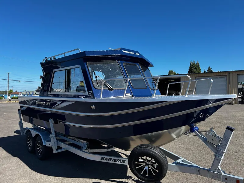 Slide: The Image of 2024 Thunder Jet 22 Alexis Pro boat on Karavan trailer, blue and silver. - 7