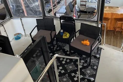 Slide: The Image of 1989 Carver 3807 Aft Cabin interior with seating area and patterned rug. - 10