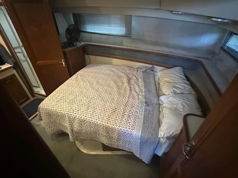 Slide: The Image of Cozy bedroom in 1989 Carver 3807 Aft Cabin yacht with patterned bedding. - 28