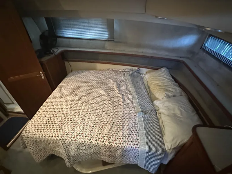 Slide: The Image of Cozy bedroom in 1989 Carver 3807 Aft Cabin yacht with patterned bedding. - 29