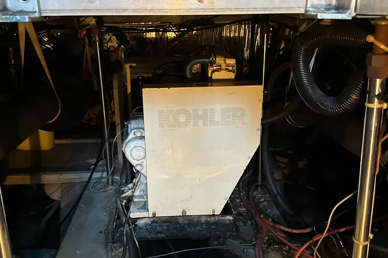 Slide: The Image of Engine room of 1989 Carver 3807 Aft Cabin with Kohler generator. - 38
