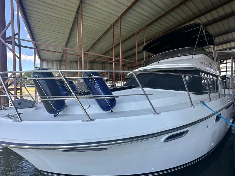 Slide: The Image of 1989 Carver 3807 Aft Cabin yacht docked in covered marina. - 4