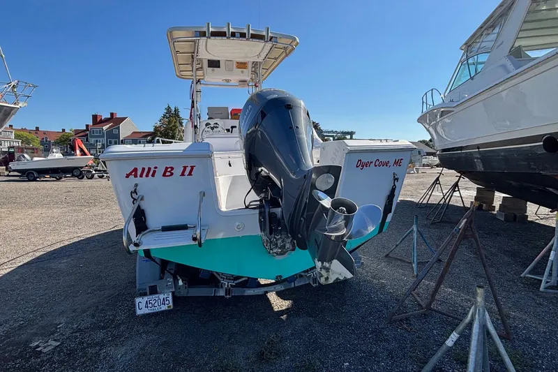 Slide: The Image of 2004 Pro-Line 20 Sport boat with outboard motor, docked at Dyer Cove, ME. - 2